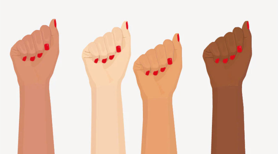 International Women's Day Break the bias, four hand of women of different skin colour, all wearing red nail polish