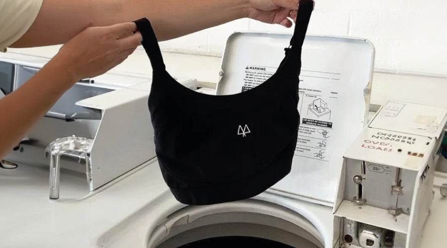 Black Maaree sports bra going in the washing machine
