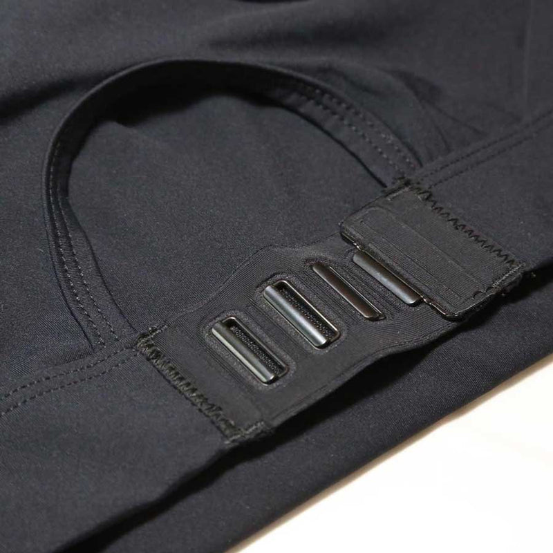 Black medium support sports bra focused on the rear clasp which is a slot and snap design.